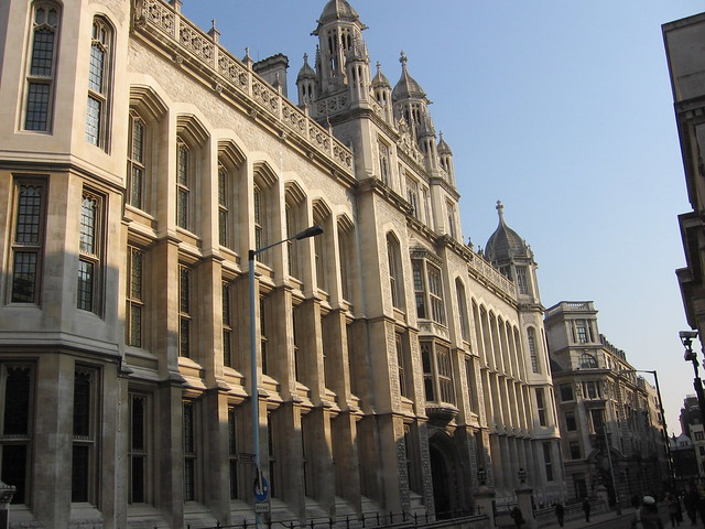 Historic university building in the United Kingdom with Gothic-style architecture under a clear blue sky
