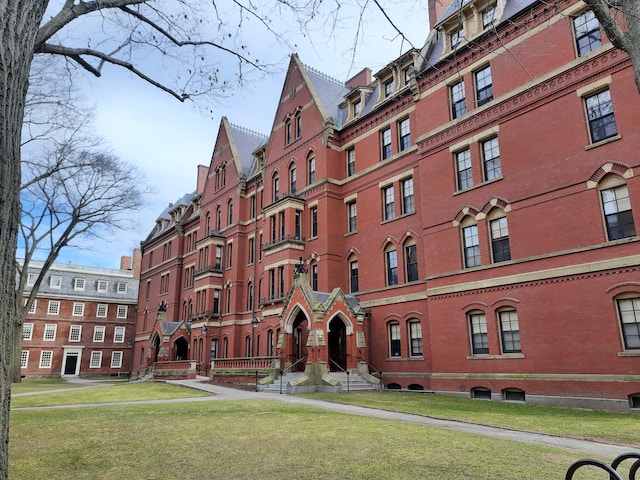 Harvard University's historic campus with iconic red-brick buildings and lush green lawns